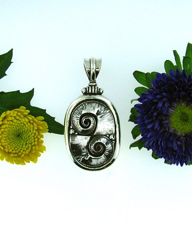 Sterling silver ornate pendant with bail.