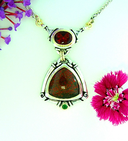 2-Tone 14k yellow gold + Sterling silver pendant with 16mm trillion cut Ammolite cab. + 9x7mm select quality Madeira Citrine and a 3.5mm round Tsavorite Garnet accent. With attached 18 in. wheat chain.