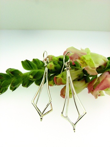 Elongated Sterling Silver fabricated french hook earrings.