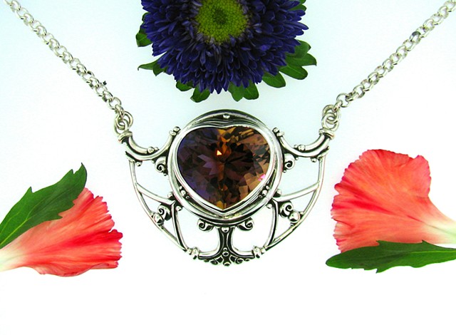 Sterling silver large pendant with 31.5 ct. select quality heart shaped Ametrine. Attached 17in. rolo chain.