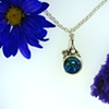 Sterling silver pendant containing a 16mm round Blue Paua Shell and a 2.5mm cz accent.