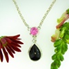 Fabricated Sterling Silver pendant with 12mm round Pink CZ accent + a 25x18mm pear shaped Black Onyx cab. 
