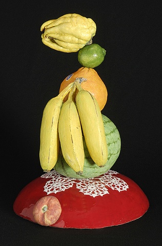 ceramic portrait with buddha's hand, lime, orange, bananas, kumquat, and watermelon by Linda S Fitz Gibbon