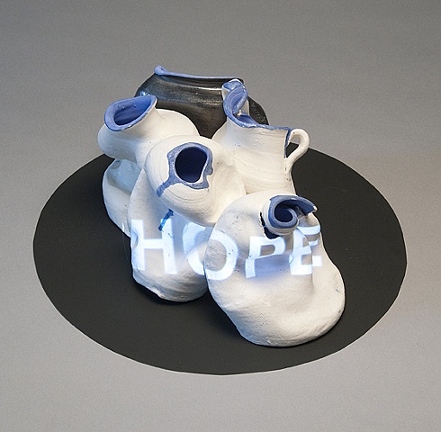 Wheel thrown and altered ceramic vessels with projected text "Hope" by Linda S Fitz Gibbon