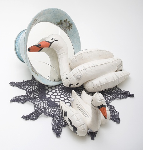 Narcissus, large tea cup and inflatable ceramic swans by Linda S Fitz Gibbon
