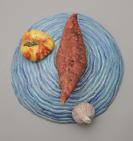 trompe l'oeil ceramic plate with ceramic yam, donut peach, and garlic by Linda S Fitz Gibbon