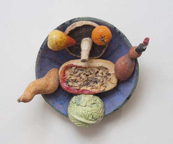 Wall mounted ceramic plate with seasonal produce