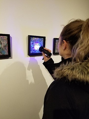 Looking at the paintings with a UV light
