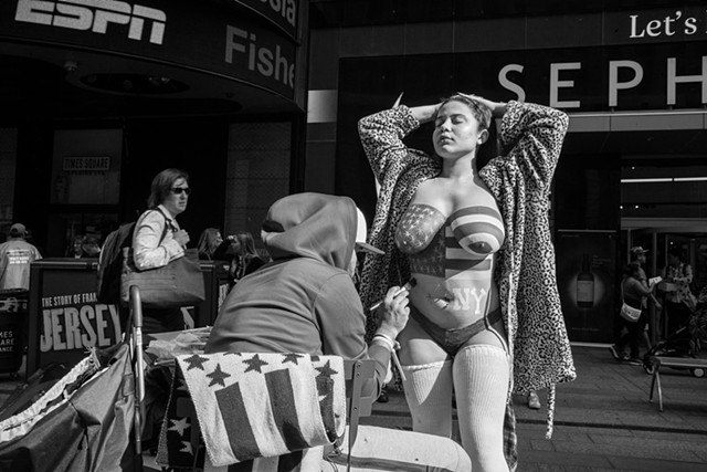 Photograph of a Desnuda being painted in Times Square, NY, Manhattan, by Judith Ebenstein