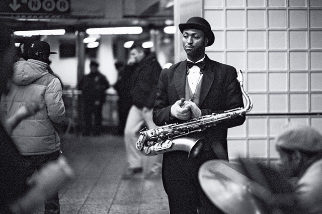 Photograph of a Saxophonist, Times Square Subway, Manhattan, New York, by Judith Ebenstein