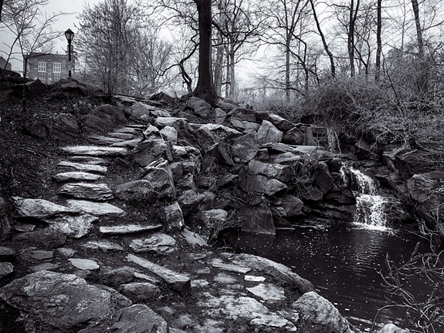 Photograph of Central Park, NYC, Manhattan, with rocks and waterfall by Judith Ebensteinby Judith Ebenstein