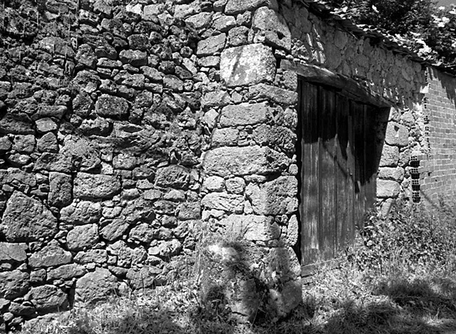 "Rock Wall with Wooden Door"

Remains of an old house in Trasulfe, Spain
