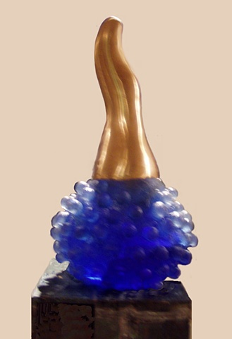 A cast glass and bronze sculpture that illustrates the moment of conception