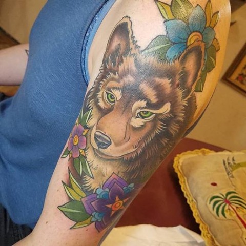 brown wolf and flowers