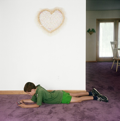 Boy playing video game, manufactured display home, © Amy Eckert www.amyeckertphoto.com