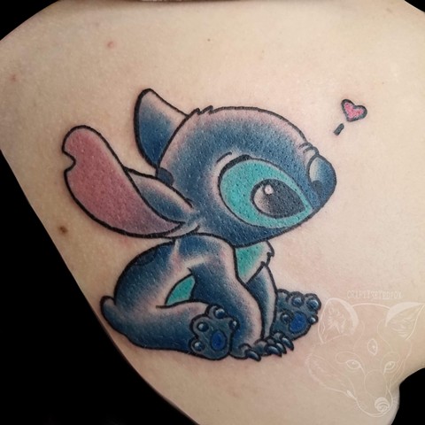 Stitch from Disney’s lilo and stitch on shoulder 