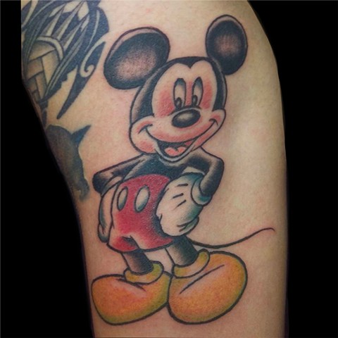 Mickey Mouse tattoo on upper arm by Gina Marie of Copper Fox in Kissimmee Florida