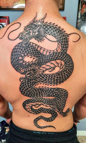 Tattoos, tattooing, tattooshop, black and grey tattoo, dragon tattoo, dragons for back tattoos, tattooshops near disney, 