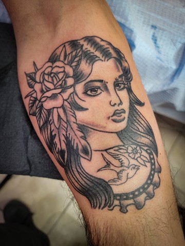 traditional black and grey girl head on forearm by Gina Matuo of Copper Fox in Kissimmee Florida best tattoo shop
