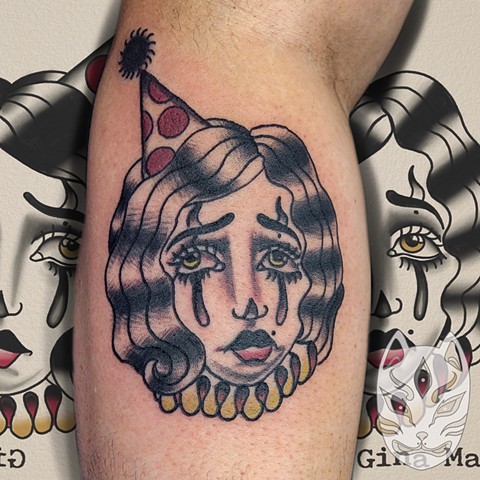 Traditional style tattoo of sad clown girl on forearm by Gina Matuo of Copper Fox Tattoo in Kissimmee Florida