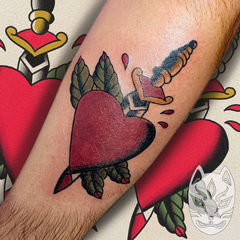 Traditional heart and dagger tattoo by Gina Matuo of copper Fox tattoo in Kissimmee Florida