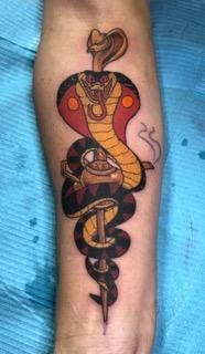 Jafar cobra and staff from the Disney Film Aladdin by Tahiti Gil of copper fox tattoo in Kissimmee Florida Disney tattoo artist