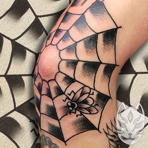 American Traditional spider web with fly elbow tattoo by Gina Matuo of Copper Fox Tattoo in Kissimmee Florida best tattoo shop