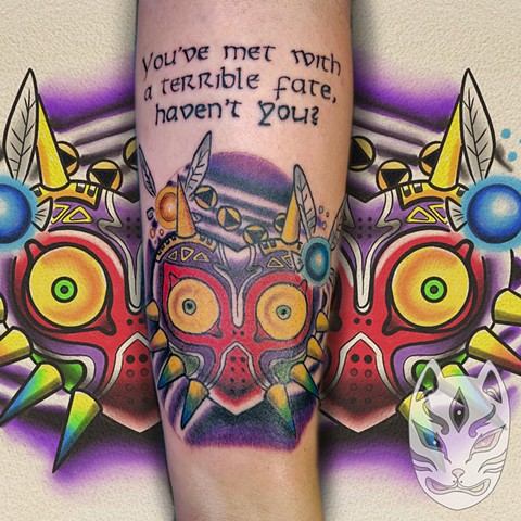 Video game tattoo of Majoras mask from the legend of Zelda game on Nintendo in full color on forearm by Gina Matuo of Copper Fox Tattoo best tattoo shop in Kissimmee florida