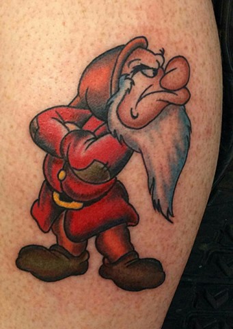 Disney Grumpy Dwarf on lower leg full color tattoo by Gina Marie of Copper Fox Tattoo Company in Kissimmee Florida