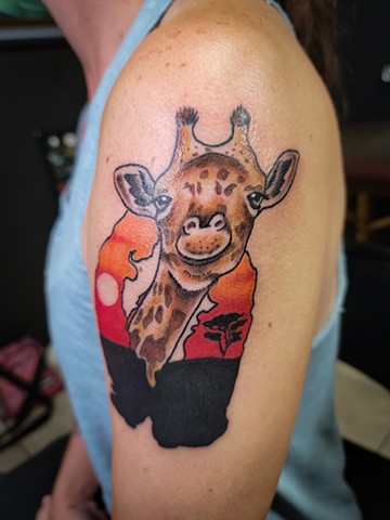 Giraffe tattoo in full color animal portrait by Gina Matuo of Copper Fox Tattoo in Kissimme Florida best tattoo shop near Disney