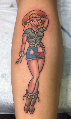Traditional style pin up from Sailor Jerry Flash with Texas Flag shorts by Tahiti Gil of Copper Fox Tattoo in Kissimmee Florida best traditional tattoo shop near me