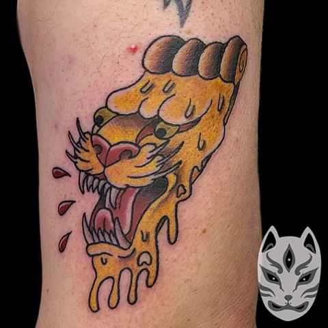 American traditional tattoo in full color on upper arm of a pizza Panther mashup design by Gina Matuo at copper Fox tattoo in Kissimmee Florida best tattoo shop near me in Kissimmee Orlando florida