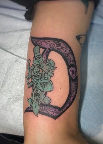 Haunted Mansion hitchhiking ghosts tattoo from the Disney attraction by Tahiti Gil of Copper Fox Tattoo in Kissimmee Florida tattoo shops near Disney   