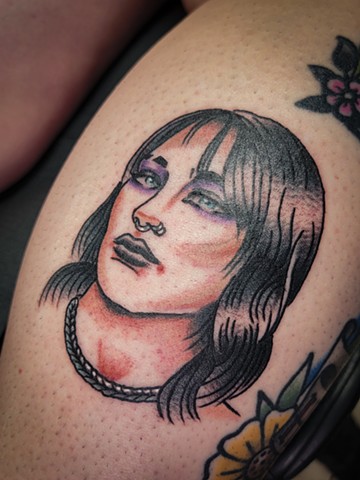 WWE superstar Rhea Ripley in American Traditional tattoo Style on lower leg by Gina Matuo of Copper Fox Tattoo in Kissimmee Florida best tattoo shop near me