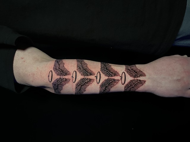 Black and grey wings, angel wings, tattoos, tattooing, tattooshop, Kissimmee tattooshop, tattooshops near disney, detailed tattoos