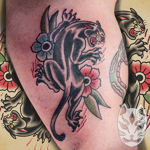 Traditional style crawling panther by traditional tattoo artist gina Matuo of copper Fox tattoo in Kissimmee Florida best tattoo shop near me