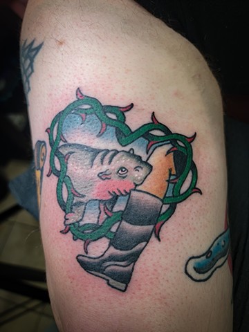 Moo Deng traditional tattoo on triceps by Gina Matuo of Copper Fox Tattoo in Kissimmee Florida Best tattoo shop near me