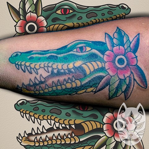 Traditional style Gator head tattoo by traditional tattoo artist Gina Matuo of copper Fox tattoo in Kissimmee Florida best tattoo shop near me
