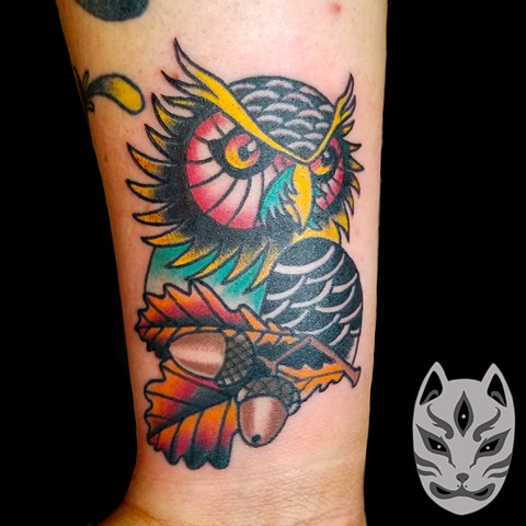 Traditional style Owl with leaves and acorns on forearm by Gina Matuo of Copper Fox in Kissimmee Florida