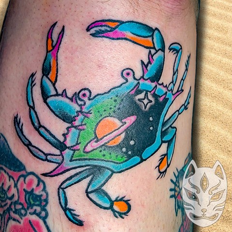 Space crab tattoo on leg in full color traditional style by Gina Matuo of Copper Fox Tattoo in Kissimmee Florida