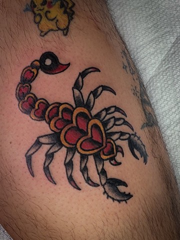 traditional tattoo of scorpion on leg by Gina Matuo of Copper Fox Tattoo in Kissimmee Florida 