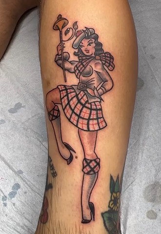 Traditional style Scottish Pin Up girl by Tahiti Gil of Copper Fox Tattoo in Kissimmee Florida near Disney best tattoo shop near me