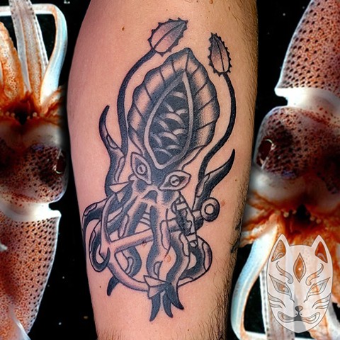 Traditional style squid with Anchor on forearm by Gina Matuo of Copper Fox in Kissimmee Florida