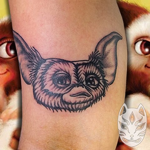 Traditional style traditional style tattoo of Gizmo from the movie Gremlins by Gina Matuo of Vopper Fox in Kissimmee Florida 