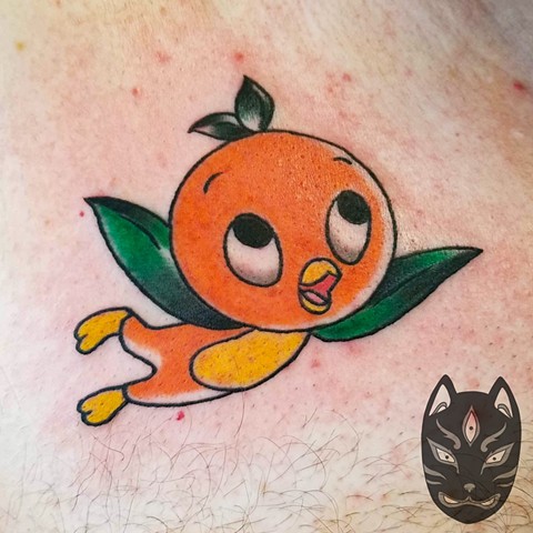 Orange Bird from Disney Dole Whip tattoo in traditional style on chest