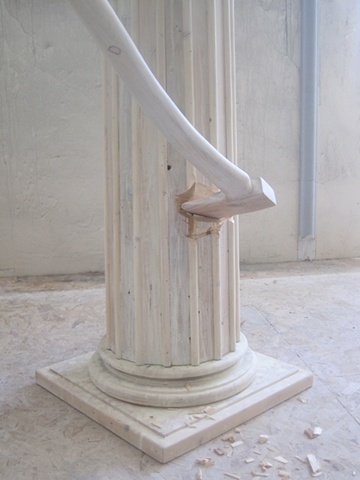 Sculpture of column and felling axe made from reclaimed lumber. 