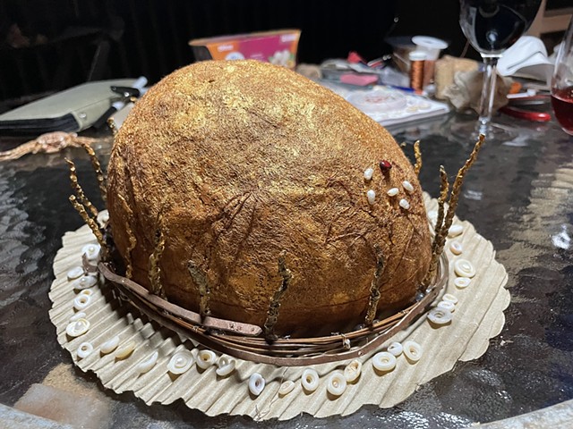 I planned out where the coconut sticks would go before attaching them to the crown. I hammered copper wire into circular circumference  to reinforce the rim of the crown.