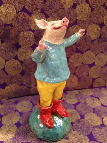 cheerful raku ceramic pig wearing boots - lisa schumaier