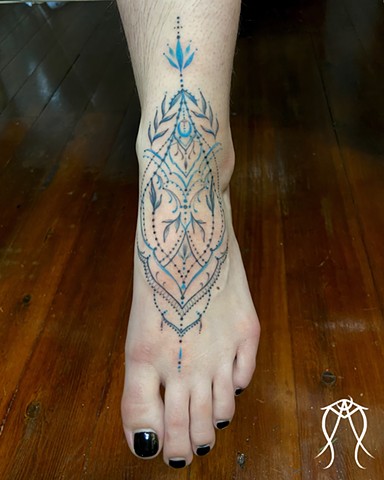 Delicate, beautiful and powerful ornamental tattoo done by Amanda Marie at ace of wands tattoo in Scipio center New York this is a private tattoo and tarot studio 