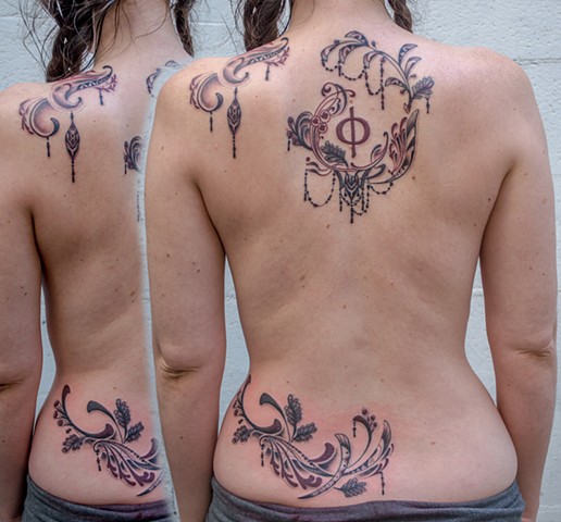 this is an art nouveau inspired geometric back piece designed and tattooed by amanda marie tattooer at evermore tattoo company in los angeles california